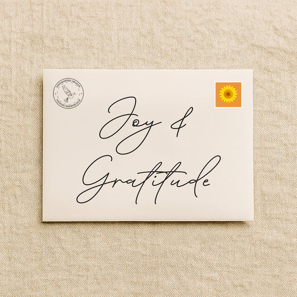 Christian gratitude letter subscription packaging with cream envelope on linen background