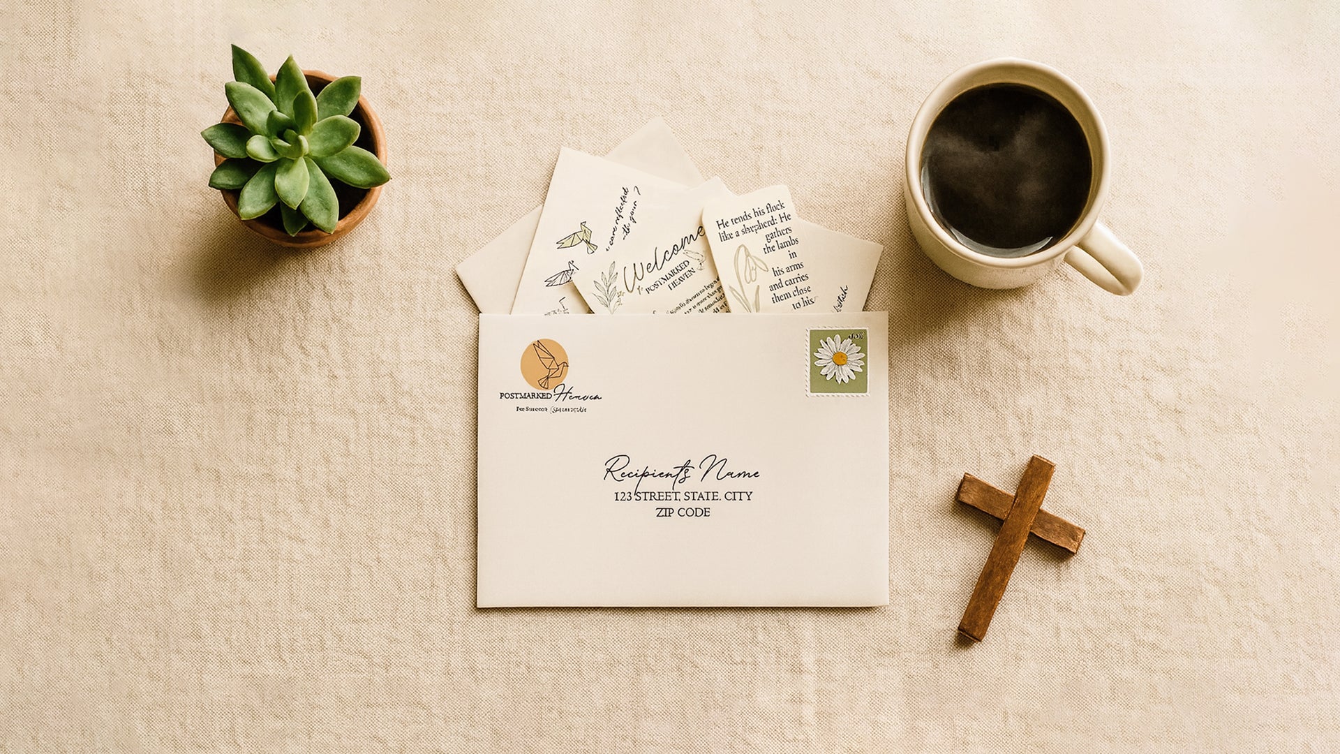 Christian letter subscription flat lay with Postmarked Heaven envelope, scripture inserts, coffee cup, wooden cross, and small plant on a linen background.